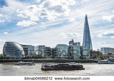 Stock Image - View over the Thames on More London Riverside with City Hall and skyscraper The Shard, Southwark, London, England, Great Britain. Fotosearch