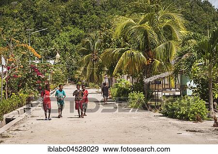 Village street with children, village Yenbuba, Mansuar, Raja-Ampat, Western New Guinea, Indonesia, Asia View Large Photo Image Stock Photo - Village street with children, village Yenbuba, Mansuar, Raja-Ampat, Western New Guinea, Indonesia, Asia. Fotosearch