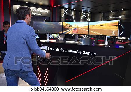 Visitors in front of a video game, Internationale Funkausstellung IFA, 2017, Berlin, Germany, Europe View Large Photo Image Stock Image - Visitors in front of a video game, Internationale Funkausstellung IFA, 2017, Berlin, Germany, Europe. Fotosearch