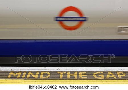 Warning sign Mind the gap on the platform from a London subway station, London, England, United Kingdom, Europe View Large Photo Image Stock Image - Warning sign Mind the gap on the platform from a London subway station, London, England, United Kingdom, Europe. Fotosearch