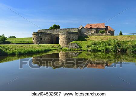 Water castle and fortress Heldrungen, gate building with bastions, exterior moat, at back the Renaissance castle, Heldrungen, Thuringia, Germany, Europe View Large Photo Image Stock Photo - Water castle and fortress Heldrungen, gate building with bastions, exterior moat, at back the Renaissance castle, Heldrungen, Thuringia, Germany, Europe. Fotosearch
