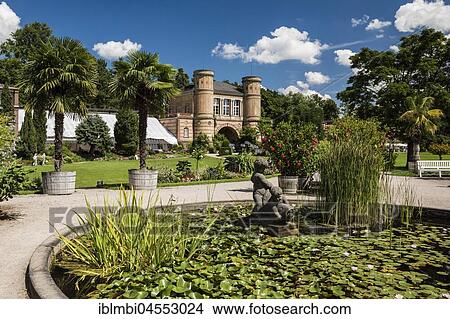 Water lily basin in front of the arched building, botanical garden in Karlsruhe Palace Gardens, Karlsruhe, Upper Swabia, Baden-Württemberg, Germany, Europe View Large Photo Image Picture - Water lily basin in front of the arched building, botanical garden in Karlsruhe Palace Gardens, Karlsruhe, Upper Swabia, Baden-Württemberg, Germany, Europe. Fotosearch