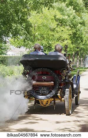 Water steam cloud comes from the exhaust, Stanley Type K "Semi-Racer", steam car from USA, built in 1908, Classic Days Schloss Dyck, Jüchen, North Rhine-Westphalia, Germany, Europe View Large Photo Image Picture - Water steam cloud comes from the exhaust, Stanley Type K "Semi-Racer", steam car from USA, built in 1908, Classic Days Schloss Dyck, Jüchen, North Rhine-Westphalia, Germany, Europe. Fotosearch