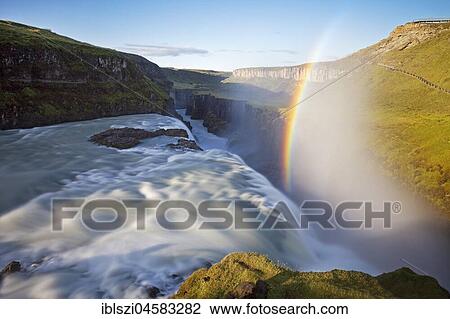 Stock Image - Waterfall Gullfoss with Rainbow, Golden Circle, Hvítá River, Haukadalur, South Iceland, Iceland, Europe. Fotosearch