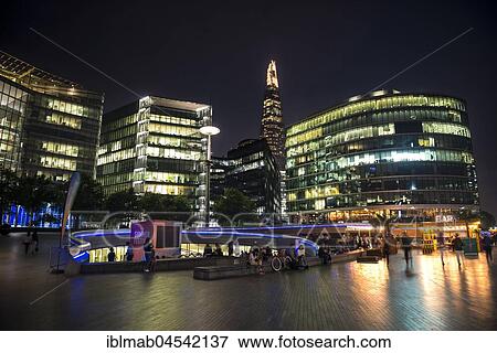 Stock Photo - Waterfront at night, More London Riverside, The Shard at back, London, England, United Kingdom, Europe. Fotosearch