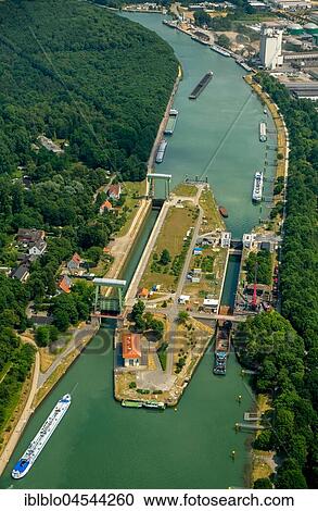Wesel Datteln canal, lock with construction works, inland waterway and freighter traffic jam in lock basin, Dorsten, Ruhr area, North Rhine-Westphalia, Germany, Europe View Large Photo Image Stock Image - Wesel Datteln canal, lock with construction works, inland waterway and freighter traffic jam in lock basin, Dorsten, Ruhr area, North Rhine-Westphalia, Germany, Europe. Fotosearch