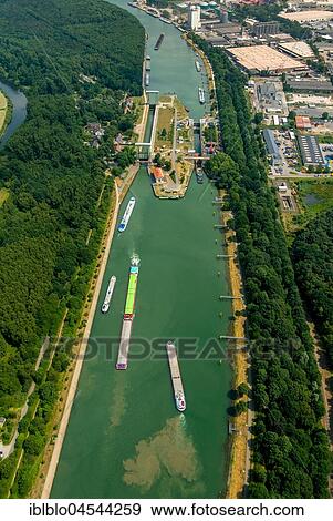 Wesel Datteln canal, lock with construction works, inland waterway and freighter traffic jam in lock basin, Dorsten, Ruhr area, North Rhine-Westphalia, Germany, Europe View Large Photo Image Stock Photo - Wesel Datteln canal, lock with construction works, inland waterway and freighter traffic jam in lock basin, Dorsten, Ruhr area, North Rhine-Westphalia, Germany, Europe. Fotosearch