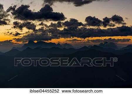 Wetterstein mountains, dark clouds at sunrise, Elemen, Lechtal, Bezirk Reutte, Tyrol, Austria, Europe View Large Photo Image Stock Image - Wetterstein mountains, dark clouds at sunrise, Elemen, Lechtal, Bezirk Reutte, Tyrol, Austria, Europe. Fotosearch