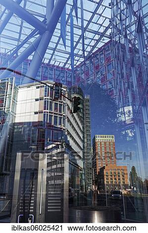 Stock Image - Win-win residential towers reflected in the Capricorn office building, Uniper headquarters, Medienhafen, Düsseldorf, North Rhine-Westphalia, Germany, Europe. Fotosearch