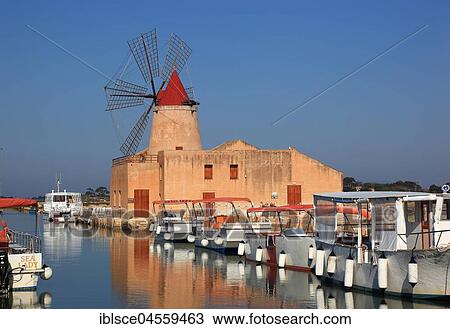Windmill and boats at the salt flats, near Mozia, small island of San Pantaleo off Marsala, Sicily, Italy, Europe View Large Photo Image Stock Image - Windmill and boats at the salt flats, near Mozia, small island of San Pantaleo off Marsala, Sicily, Italy, Europe. Fotosearch