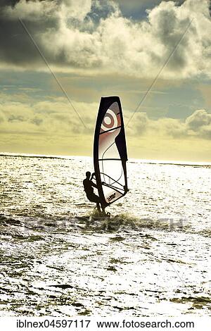 Stock Photo - Windsurfers in One Eye Bay, Le Morne, Le Morne Brabant Peninsula, Indian Ocean, Mauritius, Africa. Fotosearch