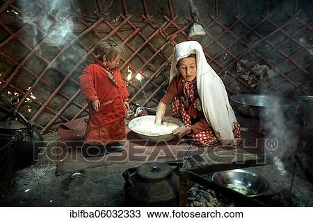 Woman and infant in traditional Kyrgyz traditional traditional traditional traditional traditional traditional traditional traditional traditional costume, dough production for flat bread, in front of her a teakettle on a fireplace, yurt, bozai... View Large Photo Image Stock Image - Woman and infant in traditional Kyrgyz traditional traditional traditional traditional traditional traditional traditional traditional traditional costume, dough production for flat bread, in front of her a teakettle on a fireplace, yurt, bozai.... Fotosearch