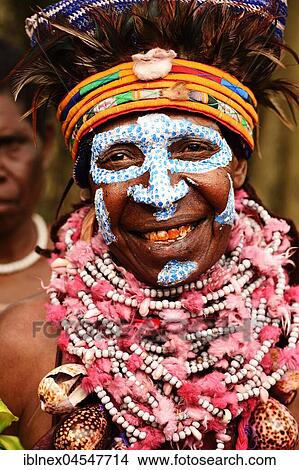 Woman of the Marowa Welda group applying make-up for the annual Sing Sing in Goroka, Papua New Guinea, Oceania View Large Photo Image Picture - Woman of the Marowa Welda group applying make-up for the annual Sing Sing in Goroka, Papua New Guinea, Oceania. Fotosearch