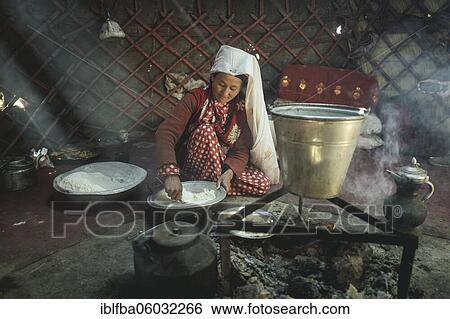 Woman stirring dough, preparation of flat bread, in front of her a kettle on a fireplace, yurt, bozai gumbaz, wakhan corridor, Badakhshan, Afghanistan, Asia View Large Photo Image Stock Photograph - Woman stirring dough, preparation of flat bread, in front of her a kettle on a fireplace, yurt, bozai gumbaz, wakhan corridor, Badakhshan, Afghanistan, Asia. Fotosearch