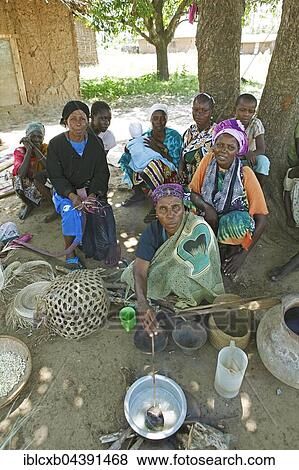 Women sitting under the village tree, ethnic group of Pokomo, Pokomo settlement, Mbelezoni, Tana River Delta, Kenya, Africa View Large Photo Image Stock Photo - Women sitting under the village tree, ethnic group of Pokomo, Pokomo settlement, Mbelezoni, Tana River Delta, Kenya, Africa. Fotosearch