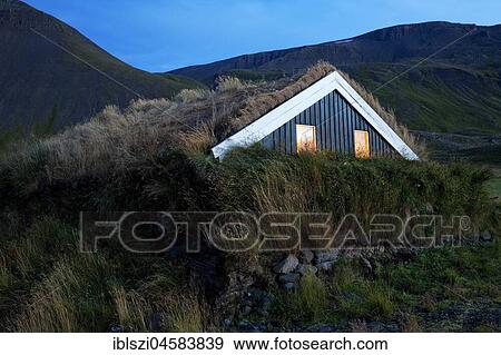 Wooden house with traditional grass turf roof in hilly landscape, Reykjadiskur, Island View Large Photo Image Stock Photo - Wooden house with traditional grass turf roof in hilly landscape, Reykjadiskur, Island. Fotosearch