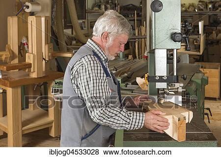 Wooden mask carver cutting a wooden block using a band saw, Bad Aussee, Styria, Austria, Europe View Large Photo Image Stock Photo - Wooden mask carver cutting a wooden block using a band saw, Bad Aussee, Styria, Austria, Europe. Fotosearch