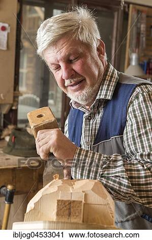 Wooden mask carver using wood carving tools on a wooden block, wooden mask, Bad Aussee, Styria, Austria, Europe View Large Photo Image Stock Image - Wooden mask carver using wood carving tools on a wooden block, wooden mask, Bad Aussee, Styria, Austria, Europe. Fotosearch