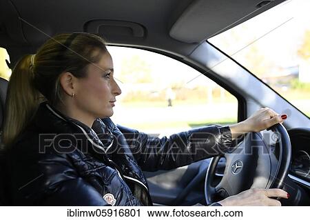 Young woman at the wheel, concentrated, Stuttgart, Baden-Württemberg, Germany, Europe View Large Photo Image Stock Image - Young woman at the wheel, concentrated, Stuttgart, Baden-Württemberg, Germany, Europe. Fotosearch