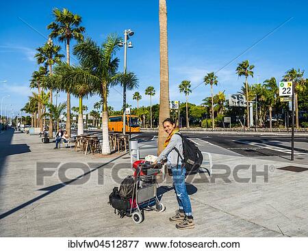 Young woman with trolley with luggage, Tenerife South airport Reina Sofia, Tenerife, Canary Islands, Spain, Europe View Large Photo Image Stock Photo - Young woman with trolley with luggage, Tenerife South airport Reina Sofia, Tenerife, Canary Islands, Spain, Europe. Fotosearch