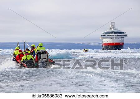 Zodiac dinghy on the way to cruise ship, ice field, cruise, east coast Greenland, Denmark, Europe View Large Photo Image Stock Image - Zodiac dinghy on the way to cruise ship, ice field, cruise, east coast Greenland, Denmark, Europe. Fotosearch