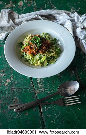Stock Image - Zucchini pasta with lentils. Fotosearch