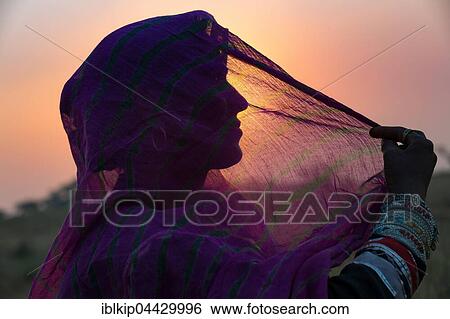 A Indian woman with colorful head scarf and jewellery, portrait, Pushkar, Rajasthan, India, Asia View Large Photo Image Stock Photograph - A Indian woman with colorful head scarf and jewellery, portrait, Pushkar, Rajasthan, India, Asia. Fotosearch