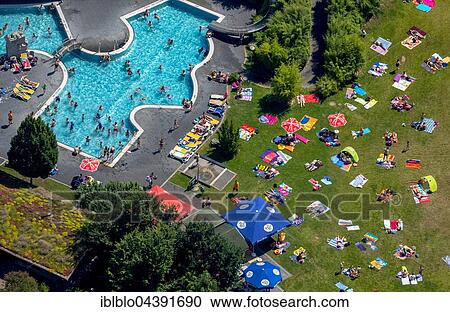 Stock Image - Aerial view, bathers at Atlantis outdoor pool, sunbathing lawn, Dorsten, Ruhr district, North Rhine-Westphalia, Germany, Europe. Fotosearch