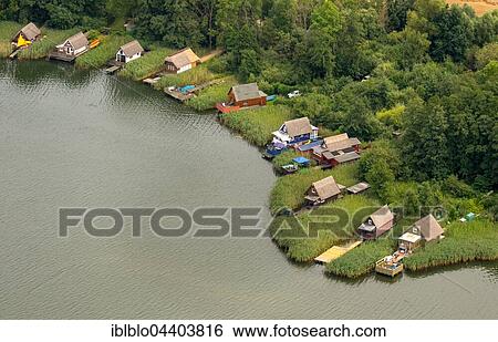 Stock Photograph - Aerial view, boathouses on Lake Krakow, Krakow Lakelands, Mecklenburg Lake District, Mecklenburg-Western Pomerania, Germany, Europe. Fotosearch