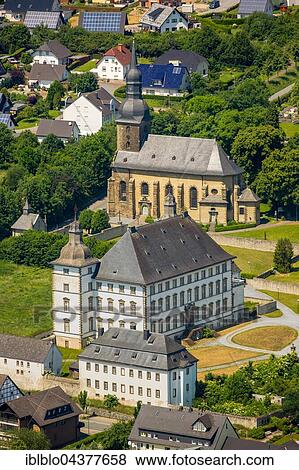 Stock Photo - Aerial view, Deutschordensschloss, German Order castle and church St. Margaretha, Mülheim, Sauerland, North Rhine-Westphalia, Germany, Europe. Fotosearch