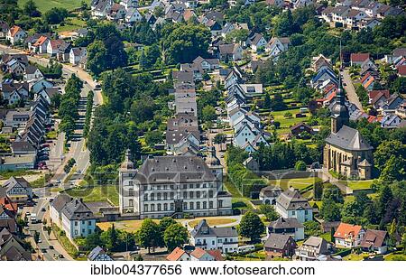 Stock Photograph - Aerial view, Deutschordensschloss, German Order castle and church St. Margaretha, Mülheim, Sauerland, North Rhine-Westphalia, Germany, Europe. Fotosearch