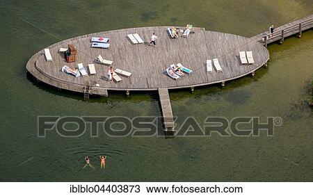 Aerial view of bathing jetty with sunbeds and bathers, Iberostar Hotel, Lake Fleesensee, Goehren-Lebbin, Mecklenburg Lakelands, Mecklenburg-Western Pomerania, Germany, Europe View Large Photo Image Stock Image - Aerial view of bathing jetty with sunbeds and bathers, Iberostar Hotel, Lake Fleesensee, Goehren-Lebbin, Mecklenburg Lakelands, Mecklenburg-Western Pomerania, Germany, Europe. Fotosearch