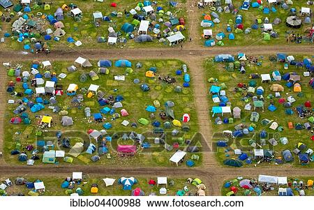 Aerial view of campers and tents at Ruhrpott Rodeo, Punk Festival, Music Festival at Schwarze Heide Bottrop Airport, Bottrop, Ruhr, North Rhine-Westphalia, Germany, Europe View Large Photo Image Stock Photo - Aerial view of campers and tents at Ruhrpott Rodeo, Punk Festival, Music Festival at Schwarze Heide Bottrop Airport, Bottrop, Ruhr, North Rhine-Westphalia, Germany, Europe. Fotosearch