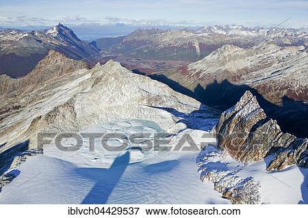 Stock Photo - Aerial view of Tierra del Fuego National Park, snowy landscape, Tierra del Fuego, Andes, Argentina, South America. Fotosearch