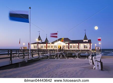 Ahlbeck seaside resort pier at dusk, full moon, Ahlbeck, Heringsdorf, Usedom, Baltic Sea, Mecklenburg-Western Pomerania, Germany, Europe View Large Photo Image Stock Image - Ahlbeck seaside resort pier at dusk, full moon, Ahlbeck, Heringsdorf, Usedom, Baltic Sea, Mecklenburg-Western Pomerania, Germany, Europe. Fotosearch