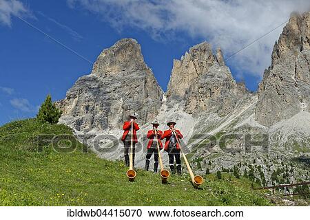 Alphorn players in front of mountains Langkofel and Plattkofel, local costume group, Fest zur ladinischen Einheit 1946, Sella, Dolomites, South Tyrol, Italy, Europe View Large Photo Image Stock Image - Alphorn players in front of mountains Langkofel and Plattkofel, local costume group, Fest zur ladinischen Einheit 1946, Sella, Dolomites, South Tyrol, Italy, Europe. Fotosearch