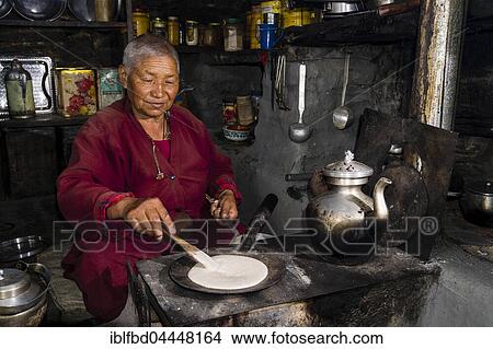 Ani Chorten, daughter of Tashi Lama, is preparing buckwheat pancakes, Praken Gompa, Manang, Manang District, Nepal, Asia View Large Photo Image Picture - Ani Chorten, daughter of Tashi Lama, is preparing buckwheat pancakes, Praken Gompa, Manang, Manang District, Nepal, Asia. Fotosearch