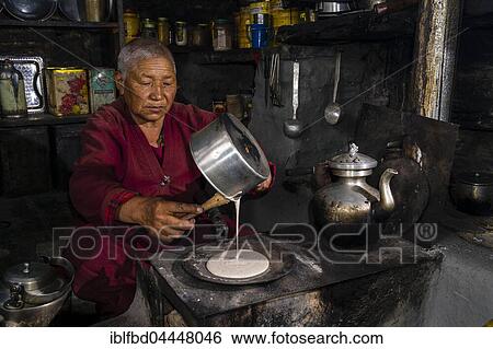 Ani Chorten, daughter of Tashi Lama, is preparing buckwheat pancakes, Praken Gompa, Manang, Manang District, Nepal, Asia View Large Photo Image Stock Photograph - Ani Chorten, daughter of Tashi Lama, is preparing buckwheat pancakes, Praken Gompa, Manang, Manang District, Nepal, Asia. Fotosearch