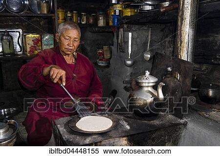 Ani Chorten, daughter of Tashi Lama, is preparing buckwheat pancakes, Praken Gompa, Manang, Manang District, Nepal, Asia View Large Photo Image Stock Photography - Ani Chorten, daughter of Tashi Lama, is preparing buckwheat pancakes, Praken Gompa, Manang, Manang District, Nepal, Asia. Fotosearch