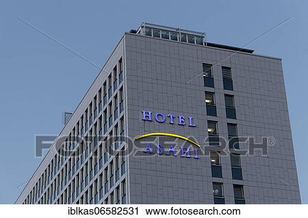 Stock Image - Asahi Hotel, illuminated lettering on the building, business hotel in the Japanese quarter of Düsseldorf, North Rhine-Westphalia, Germany, Europe. Fotosearch