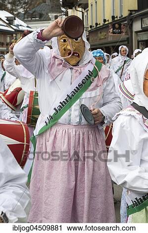 Aussee Carnival, Man with mask and pot lid as instrument, white robes, Trommelweiber, Bad Aussee, Styria, Austria, Europe View Large Photo Image Stock Image - Aussee Carnival, Man with mask and pot lid as instrument, white robes, Trommelweiber, Bad Aussee, Styria, Austria, Europe. Fotosearch