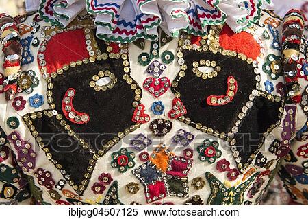 Stock Photography - Ausseer Flinserl, costume with maures heads, Ruff or Kress, sequins, different appliqué designs, Bad Aussee, Styria, Austria, Europe. Fotosearch