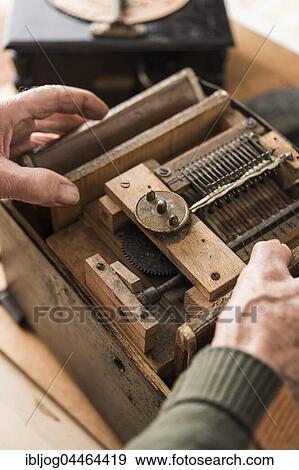 Barrel organ builder, finished organ is inserted into the case, Grassau, Upper Bavaria, Bavaria, Germany, Europe View Large Photo Image Stock Photo - Barrel organ builder, finished organ is inserted into the case, Grassau, Upper Bavaria, Bavaria, Germany, Europe. Fotosearch