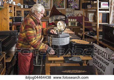 Barrel organ builder, man in barrel organ museum, Kaliston organ with perforated tape, Ariston, Grassau, Upper Bavaria, Bavaria, Germany, Europe View Large Photo Image Stock Photo - Barrel organ builder, man in barrel organ museum, Kaliston organ with perforated tape, Ariston, Grassau, Upper Bavaria, Bavaria, Germany, Europe. Fotosearch