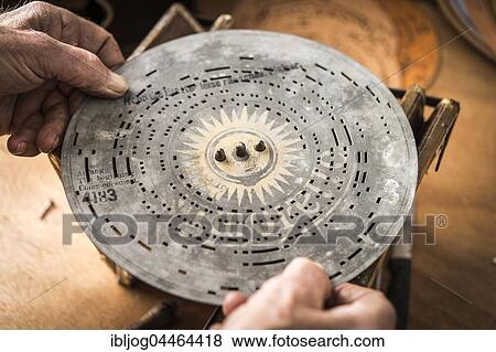 Barrel organ manufacture, perforated metal disk is placed on pin circle to check sounds, Grassau, Upper Bavaria, Bavaria, Germany, Europe View Large Photo Image Stock Photo - Barrel organ manufacture, perforated metal disk is placed on pin circle to check sounds, Grassau, Upper Bavaria, Bavaria, Germany, Europe. Fotosearch