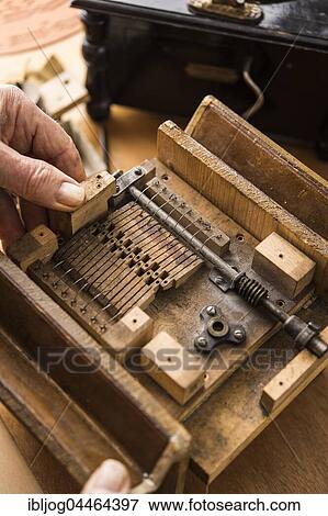 Barrel organ manufacture, workshop, hands put sound post between bellows, Grassau, Upper Bavaria, Bavaria, Germany, Europe View Large Photo Image Stock Photo - Barrel organ manufacture, workshop, hands put sound post between bellows, Grassau, Upper Bavaria, Bavaria, Germany, Europe. Fotosearch