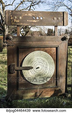 Stock Photo - Barrel organ manufacture, workshop entrance, gate with perforated metal disk, Grassau, Upper Bavaria, Bavaria, Germany, Europe. Fotosearch