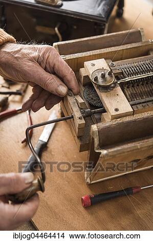 Picture - Barrel organ, proper function of bellows is checked with driving crank, final adjustment, Grassau, Upper Bavaria, Bavaria, Germany, Europe. Fotosearch