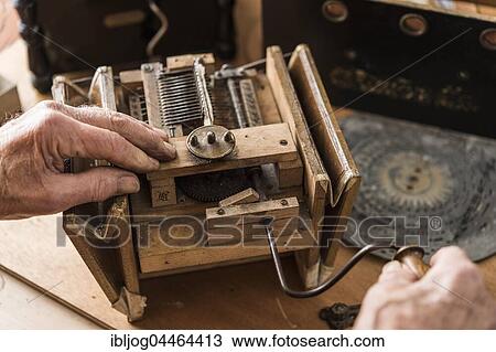 Stock Image - Barrel organ, proper function of bellows is checked with driving crank, Grassau, Upper Bavaria, Bavaria, Germany, Europe. Fotosearch