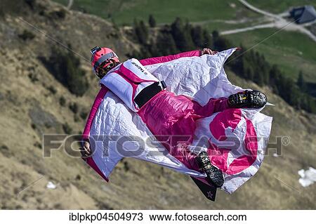 Base jumper flying with wingsuit in the air, jump from Mount Pilatus, Lucerne, Switzerland, Europe View Large Photo Image Stock Image - Base jumper flying with wingsuit in the air, jump from Mount Pilatus, Lucerne, Switzerland, Europe. Fotosearch